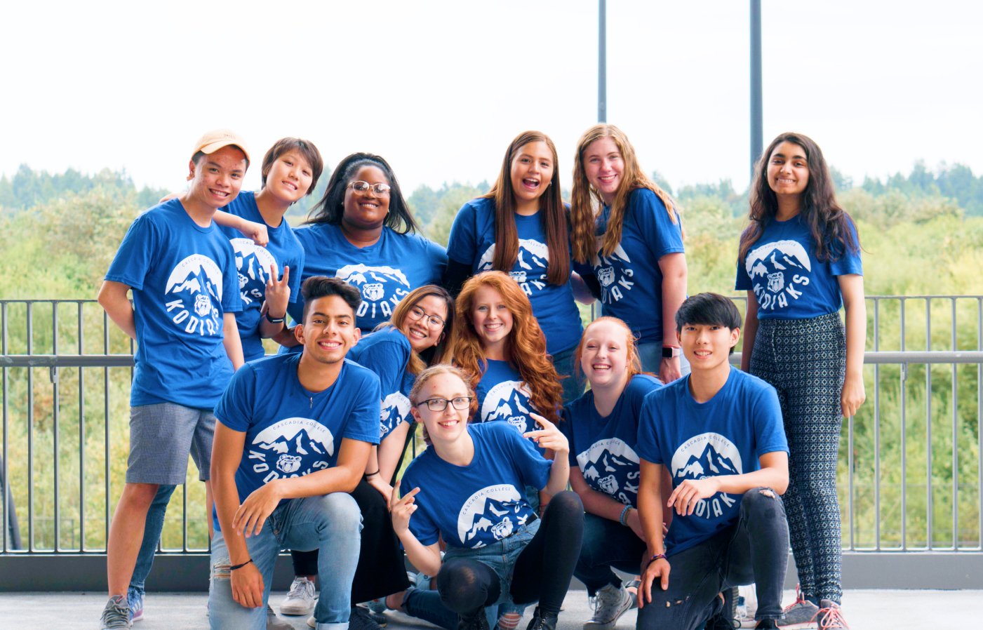 A large group of students wearing blue Cascadia shirts